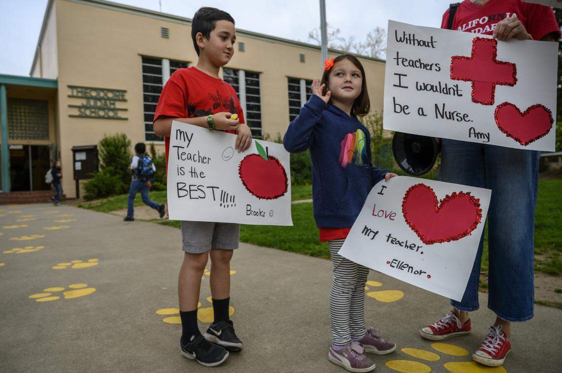 Brooks Muraki, 7, and sister Eleanor Muraki, 6, both students at Theodore Judah Elementary School, did not cross the picket line to attend school and joined picketers on Thursday, April 10, 2019 in Sacramento. Their mother Amy Sheehan who is a nurse at Kaiser South joined them outside to protest.