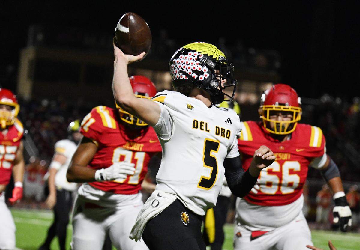 The Del Oro Golden Eagles' Nolen Sauve (5) passes the ball as the Jesuit Marauders' defense pursues in Carmichael in October. 
