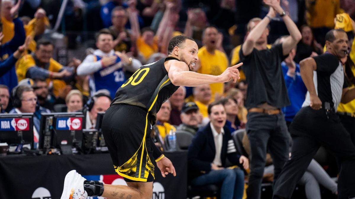 Golden State Warriors guard Stephen Curry (30) runs back in defense after scoring to the roar of the home crowd against the Sacramento Kings in the second half of Game 3 of the first-round NBA playoff series at Chase Center in San Francisco on Thursday, April 20, 2023.