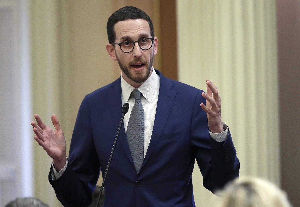 In this June 28, 2018, file photo State Sen. Scott Weiner, D-San Francisco, talks during a Senate hearing in Sacramento.