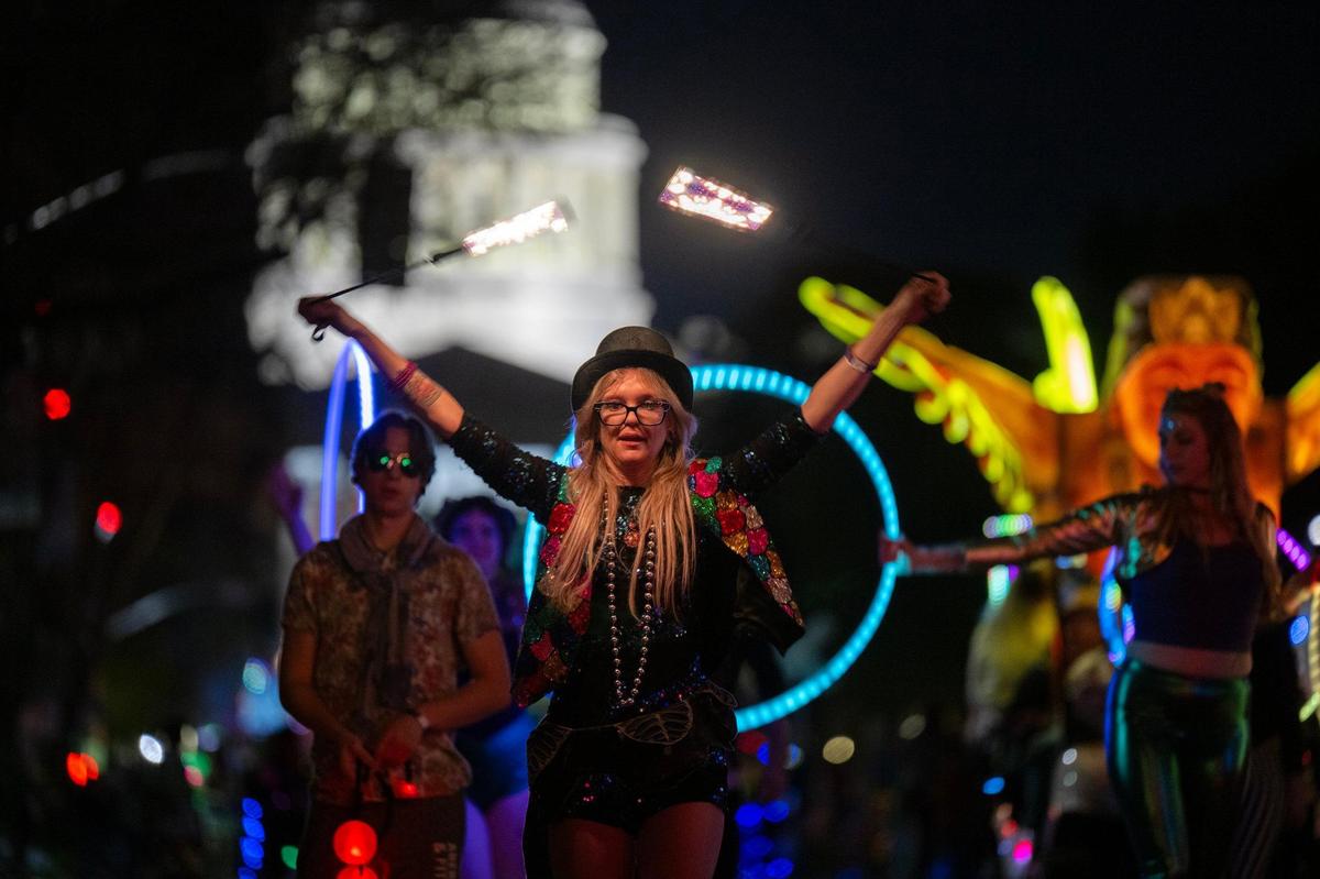 Mandi Durborough performs with the Southside Flow at the City of Trees Parade to celebrate Mardi Gras on Saturday.