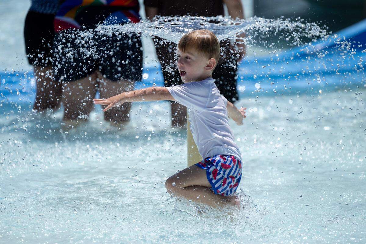 Zayd Gmyr, 4, cools off in the pool at North Natomas Aquatic Complex as temperatures reach 103 degrees on Monday, July 1, 2024 in Sacramento. His mom, Ezra Gmyr, drove from the Arden area to the pool and said he is just learning to swim.