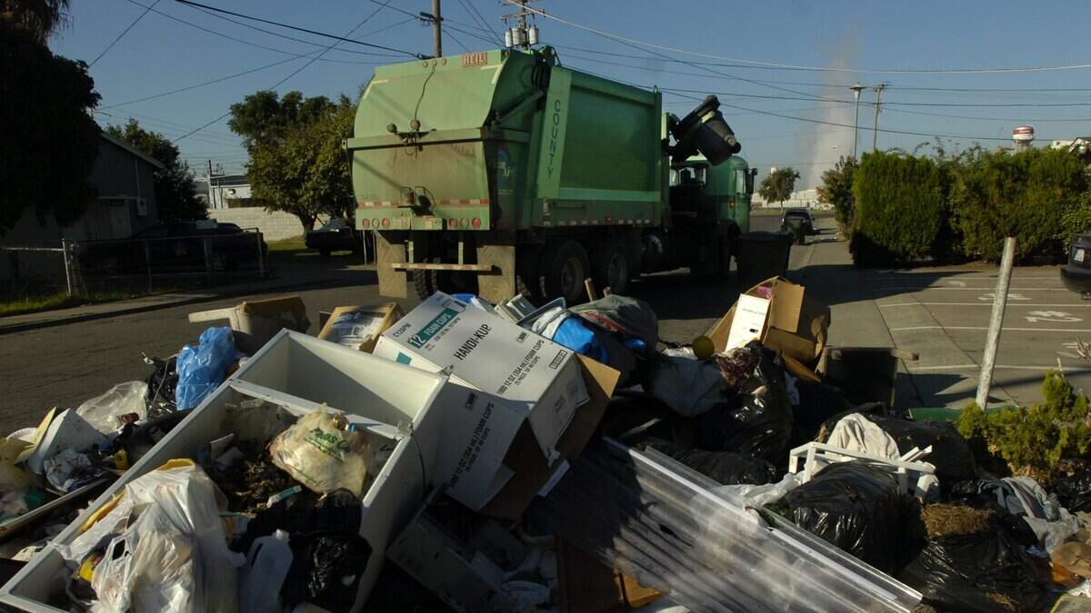 A Sacramento County garbage truck makes a pickup in this file photo.