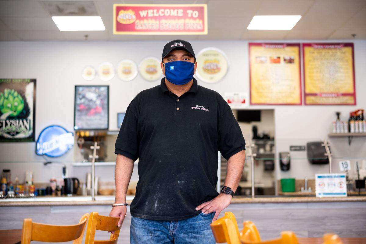 Rancho Steve’s Pizza owner Harry Khangura stands Thursday in his restaurant, which is struggling during the coronavirus pandemic that has resulted in a dramatic increase of remote working and nearby Rancho Cordova office buildings left largely vacant.