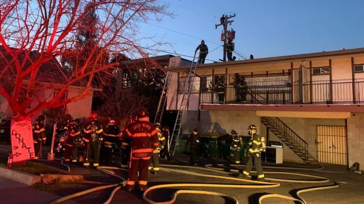 An unidentified man climbed a power pole in Sacramento’s Curtis Park neighborhood after allegedly setting a fire on a nearby rooftop on Wednesday, February 9, 2022. He eventually came down and was detained by police.