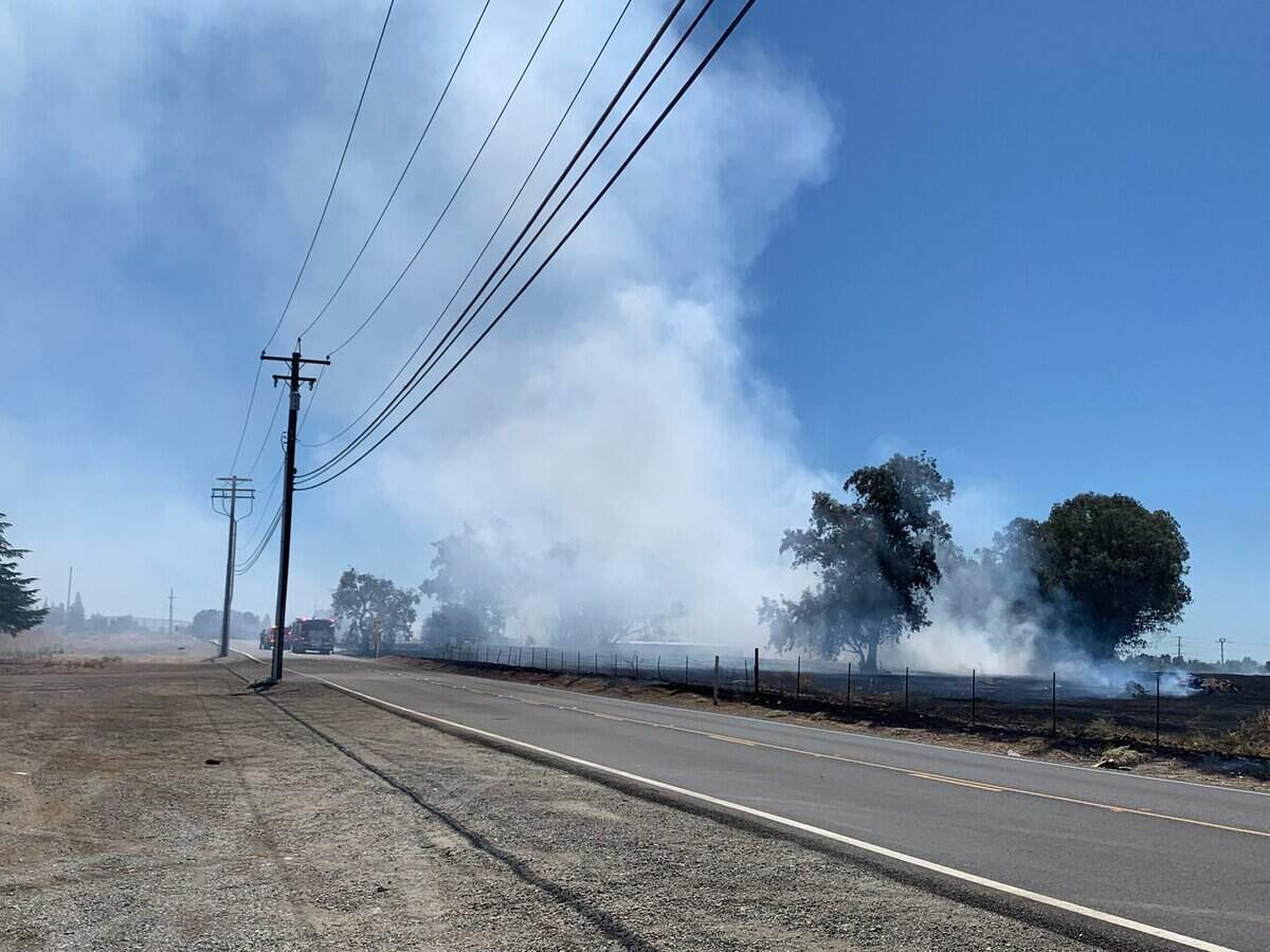 Smoke billows from a a vegetation fire off North Antelope and Antelope roads that drew the response of Metro Fire of Sacramento crews Thursday afternoon, Aug. 11, 2022.