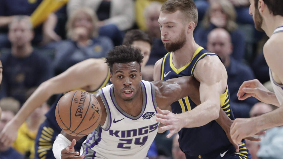 Indiana Pacers forward Domantas Sabonis (11) defends Sacramento Kings guard Buddy Hield (24) during the second half of an NBA basketball game in Indianapolis, Saturday, Dec. 8, 2018. The Pacers defeated the Kings 107-97. (AP Photo/Michael Conroy)