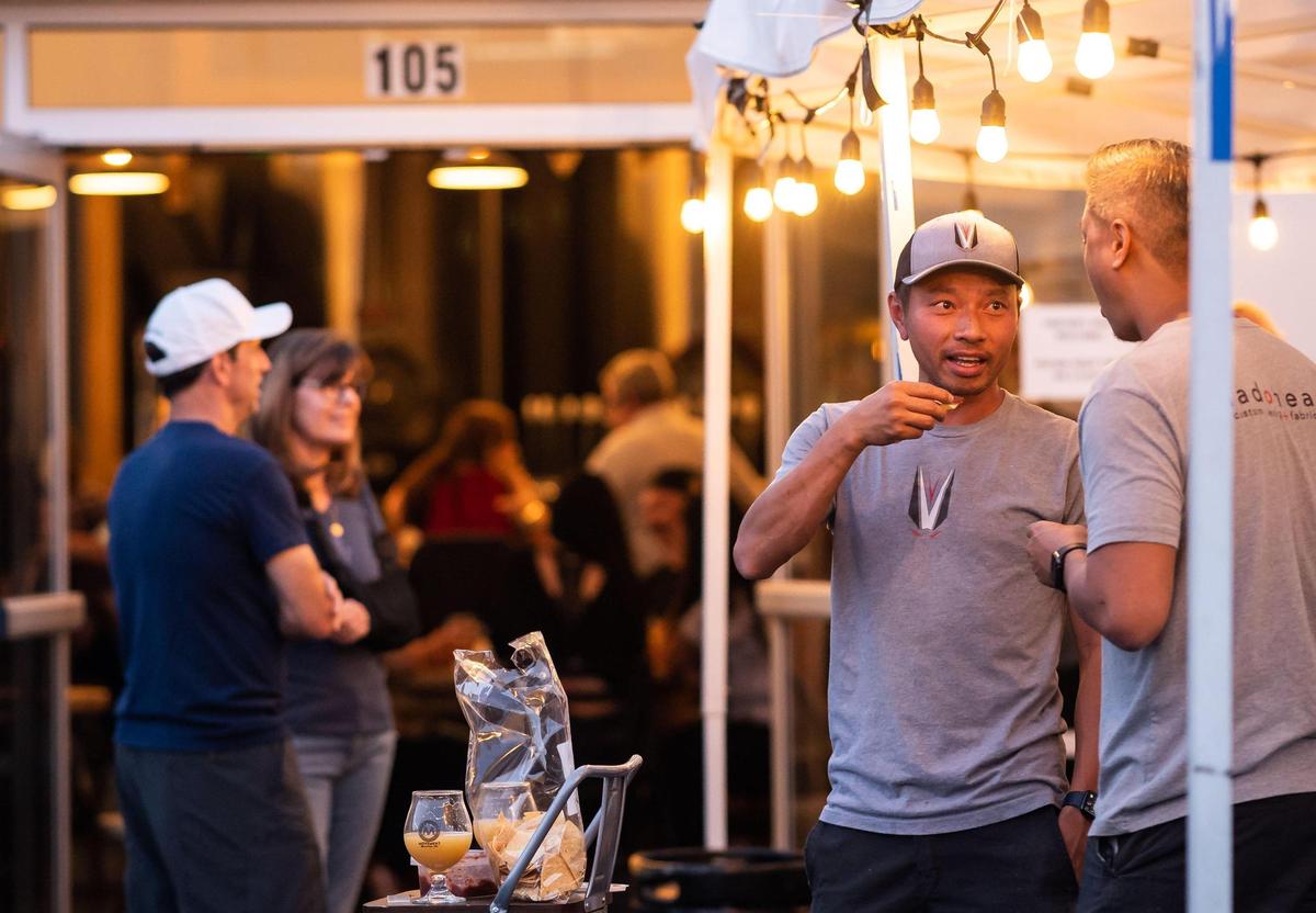 Huu Pham, center, and Henry Tran, owners of design and fabrication firm Dadoheads in Rancho Cordova, spend time after work under the covered area in front of Movement Brewing Company on Friday, Oct. 1, 2021, in Rancho Cordova. “A lot of breweries have been popping up our Rancho area,” Pham said, adding that Movement is “a great place to hang out after work, or bring our families out and have a good time.”