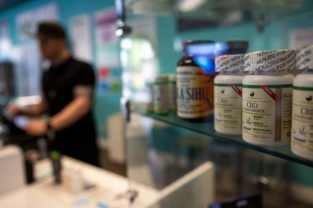 Cannabis products are seen in a case as Aaron Grove, owner of Elk Grove CBD, rings up a purchase Saturday, April 13, 2024. Elk Grove, a city that prides itself on economic growth, urban planning and development, prohibited cannabis (a multi-billion dollar industry) from operating in its city limits.
