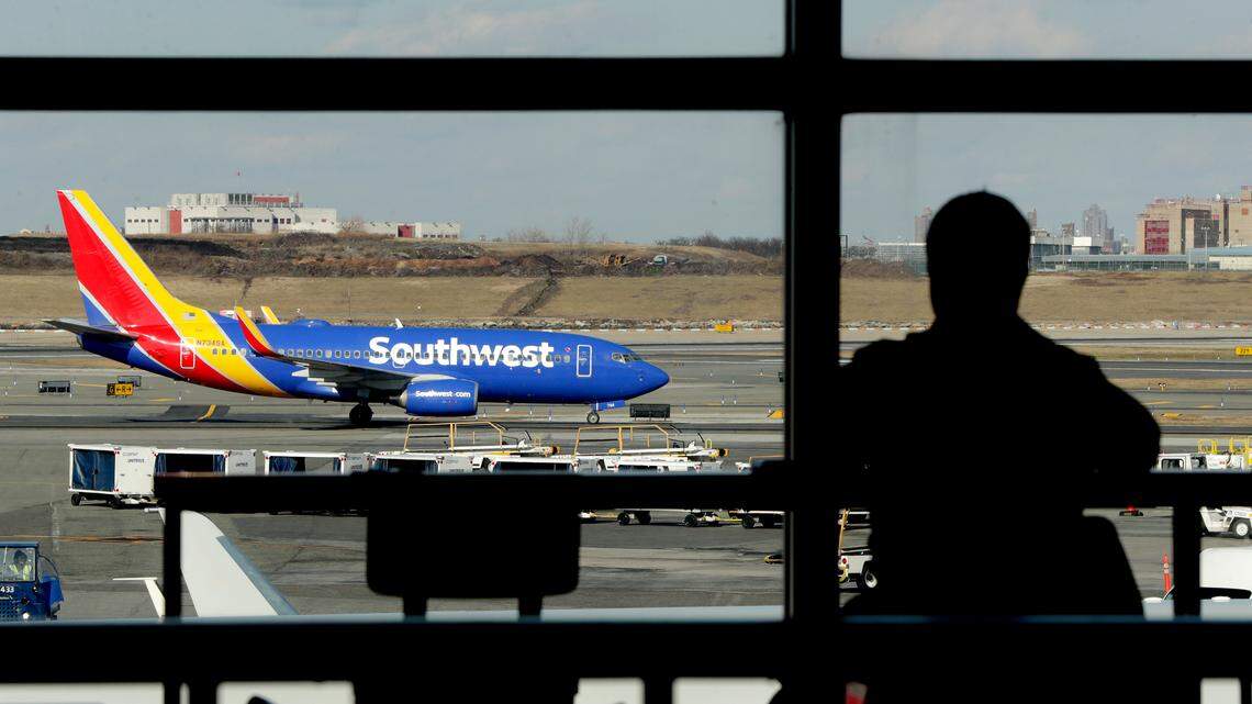 A Southwest Airlines jet taxis LaGuardia Airport in New York in 2019. A passenger on a Southwest flight from Sacramento to San Diego is accused of assaulting a flight attendant, knocking two of her teeth out.