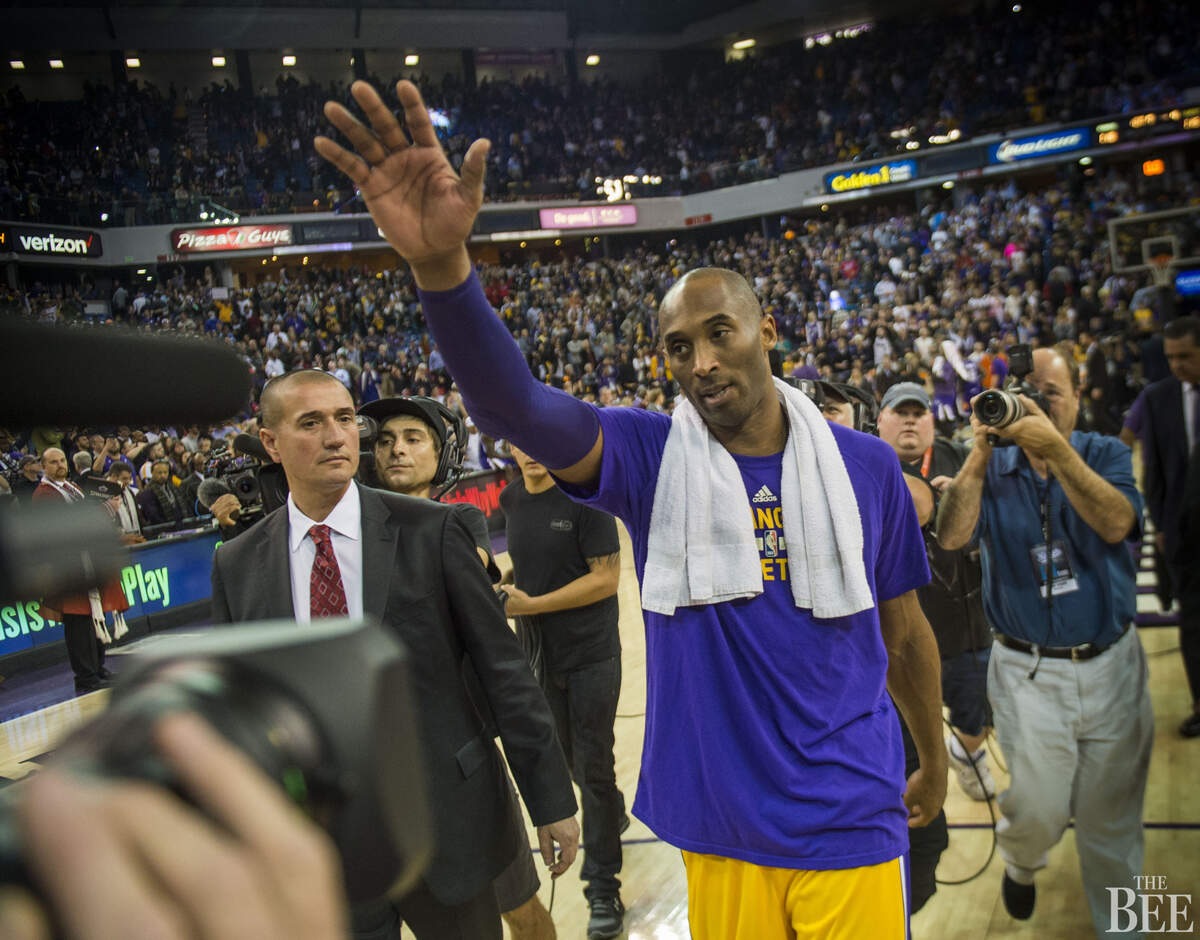 Los Angeles Lakers forward Kobe Bryant (24) waves to crowd after his team’s 118-115 loss against the Sacramento Kings.