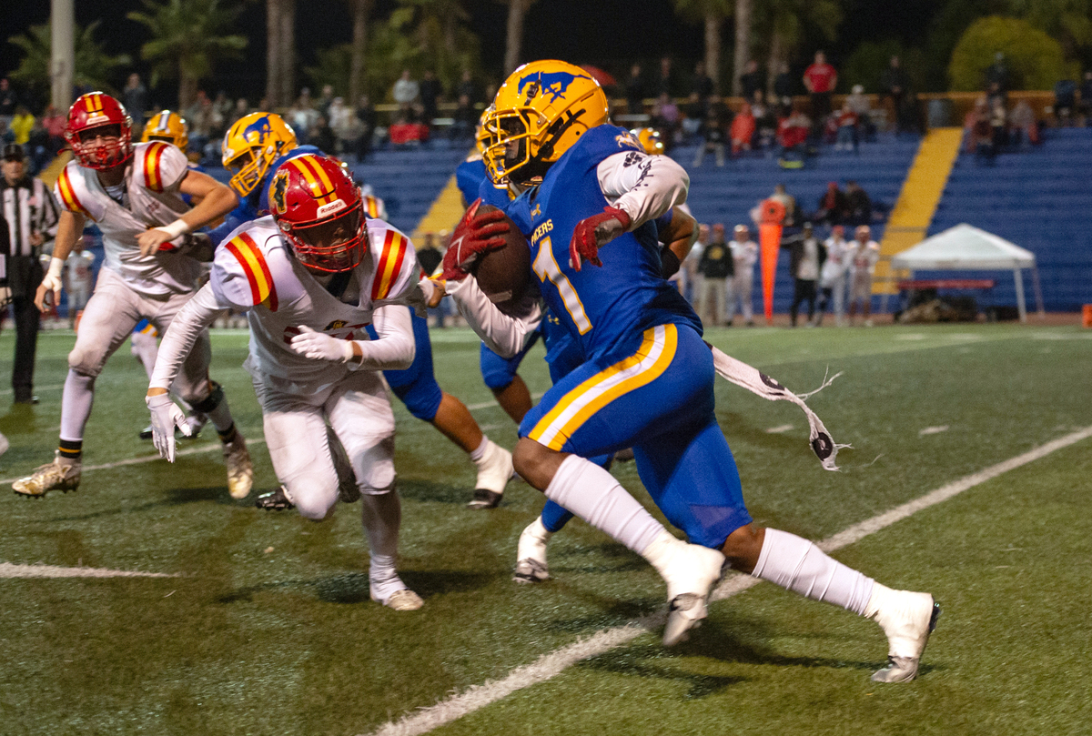 Grant Pacers running back Wayshawn Parker (1) picks up yardage against Oakdale in a CIF Sac-Joaquin Division III semifinal game on Nov. 17.