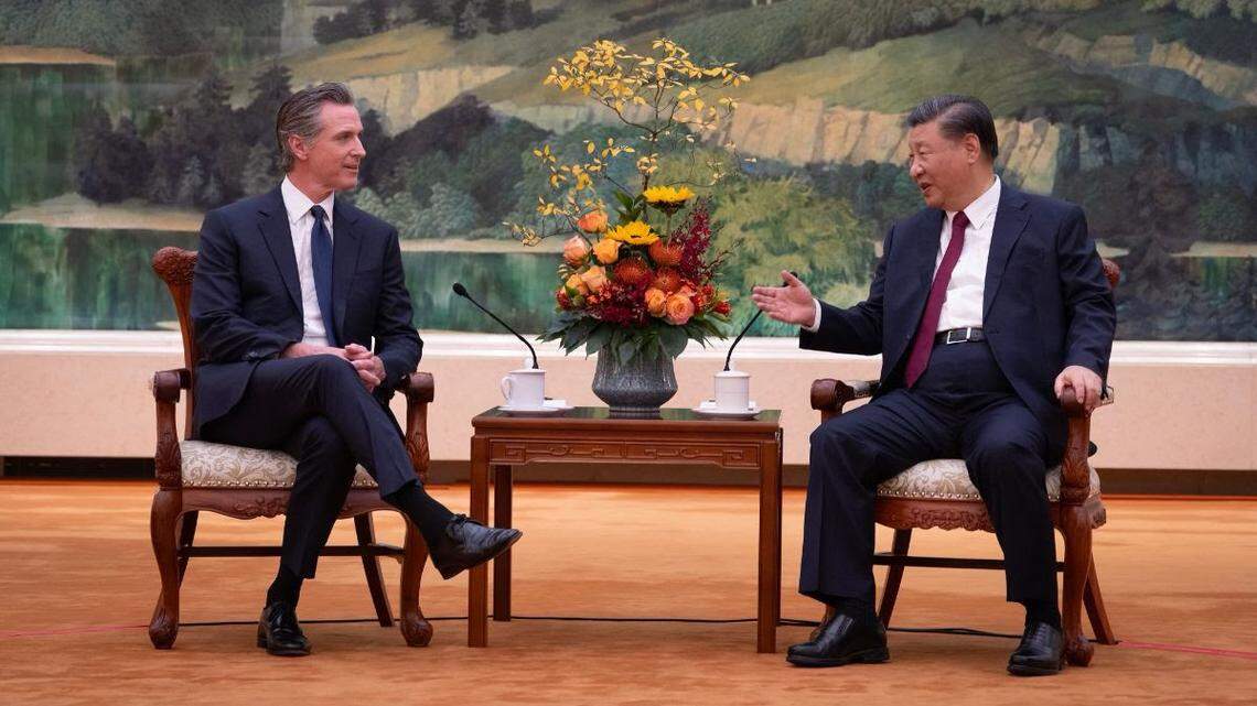 California Gov. Gavin Newsom, left, met last year with Chinese President Xi Jinping in Beijing as part of the governor’s climate trip to China. Now Newsom chose a long commute.