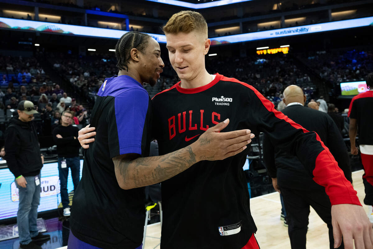 Sacramento Kings forward DeMar DeRozan (10) greets Chicago Bulls guard Kevin Huerter (13) before a NBA game at Golden 1 Center on Thursday, March 20, 2025, in Sacramento.
