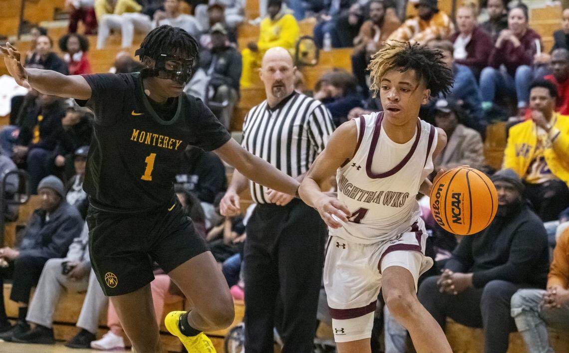 Natomas Nighthawks guard Manno Jenkins (4) evades the Monterey Dores’ Suheib Ibrahim (1) as he brings the ball down the court during a CIF Northern California regional boys basketball semifinal on Saturday, March 2, 2024, in Sacramento.