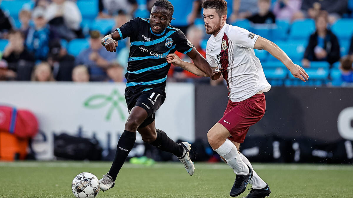 Colorado Springs, Colorado Springs Switchbacks FC, Sacramento Republic FC, Switchbacks FC, USL, football, soccer Jul 1, 2022; Colorado Springs, CO, USA; Colorado Springs Switchbacks FC forward Michee Ngalina (11) and Sacramento Republic FC defender Lee Desmond (4) battle for the ball in the first half at Weidner Field. Credit: Isaiah J. Downing/Switchbacks FC