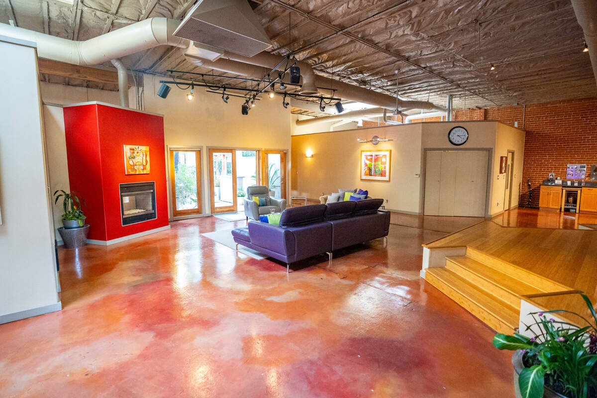 The wide open living room design allows easy access to the rest of the warehouse home on Wednesday, April 3, 2024.