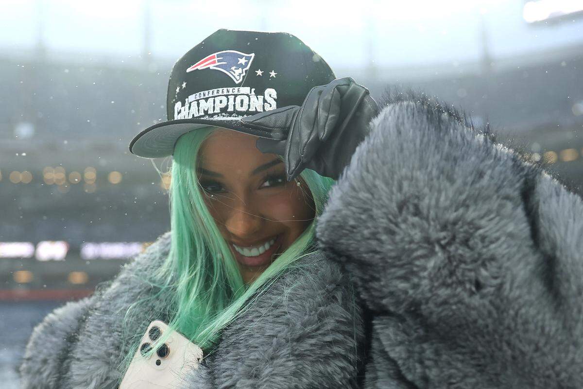 Rapper Cardi B poses for a photo following the AFC Championship Playoff game against the Denver Broncos on Jan. 25 in Denver. The New England Patriots defeated the Denver Broncos 10-7 to make it to Super Bowl LX this Sunday in Santa Clara.