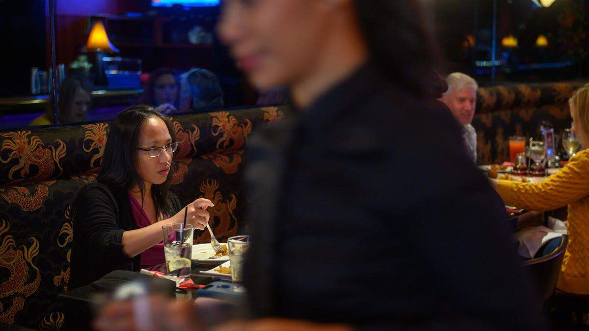 Diners at Frank Fat’s enjoy a lush interior.