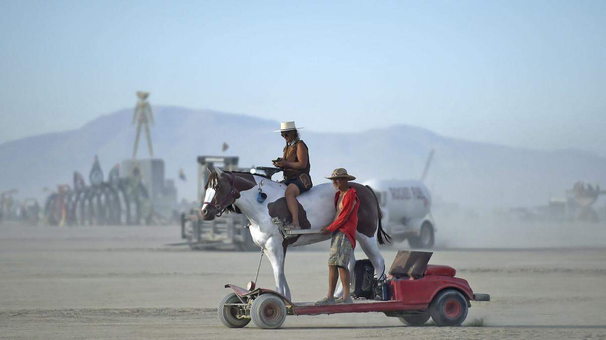 Burners cruise on an art car at the Burning Man festival near Gerlach, Nevada, on Sunday, Aug. 28, 2022.