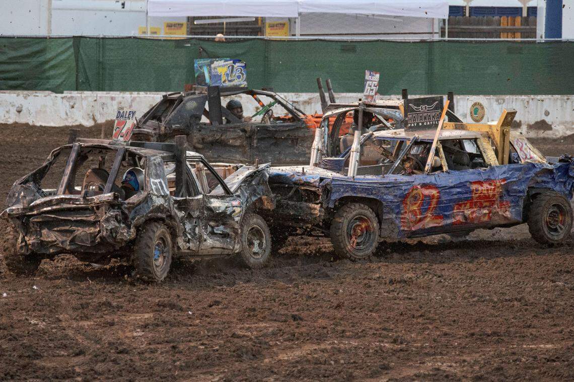 Ryan Chivers (82) defeats John Daley (7) in a head-on collision to win the demolition derby at Rodeo Arena inside the California State Fair on Saturday, July 22, 2023, in Sacramento.