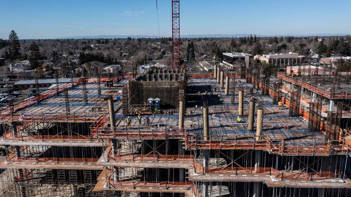 Construction work continues at the planned Aggie Square innovation hub at the UC Davis Medical Center campus in Sacramento on Tuesday, Jan. 31, 2023.