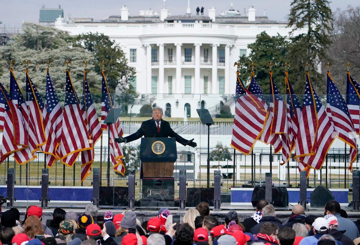 With the White House in the background, President Donald Trump speaks at a rally in Washington on Jan. 6, 2021, before rioters stormed the U.S. Capitol. Taylor Budowich was subpoenaed by a House of Representatives committee investigating the riot, which said it had “credible evidence” of his involvement in activities leading up to the events of the day.