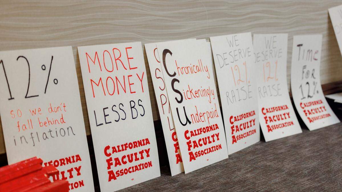 Signs made by the California Faculty Association.
