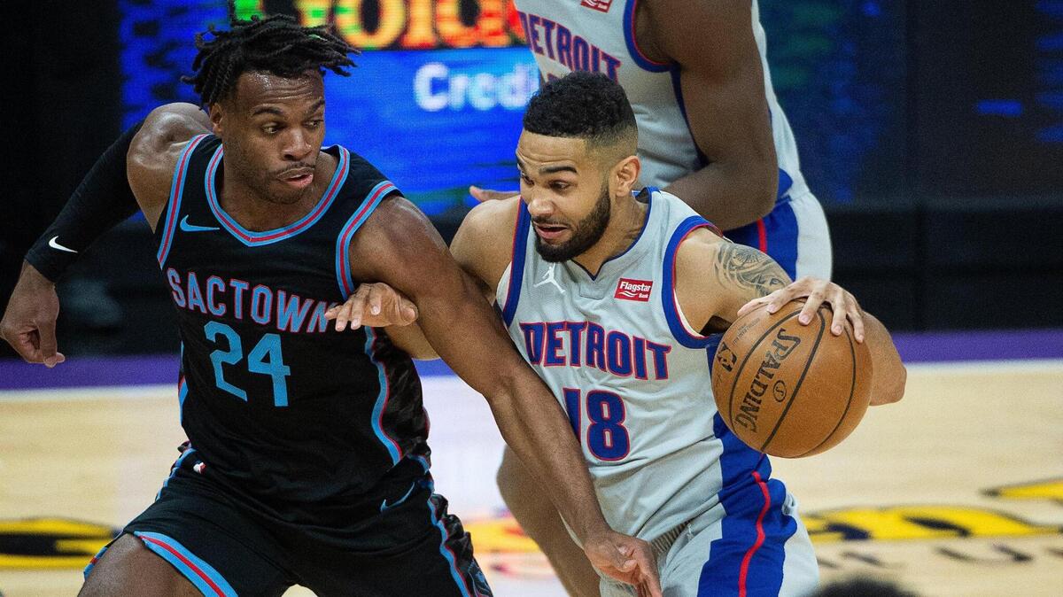 Detroit Pistons guard Cory Joseph (18), returning to Sacramento the first time since being traded by the Kings, drives against Kings guard Buddy Hield (24) in the first quarter during a game at Golden 1 Center in Sacramento on Thursday, April 8, 2021.
