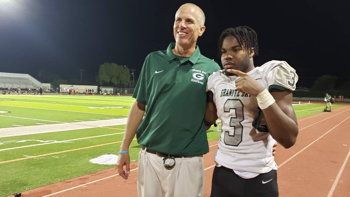 Granite Bay High School football coach Joe Cattolico, left, and running back Carter Jackson led the Grizzlies to a 34-13 victory over Vacaville on Friday, Sept. 15, 2023, in Vacaville, California.