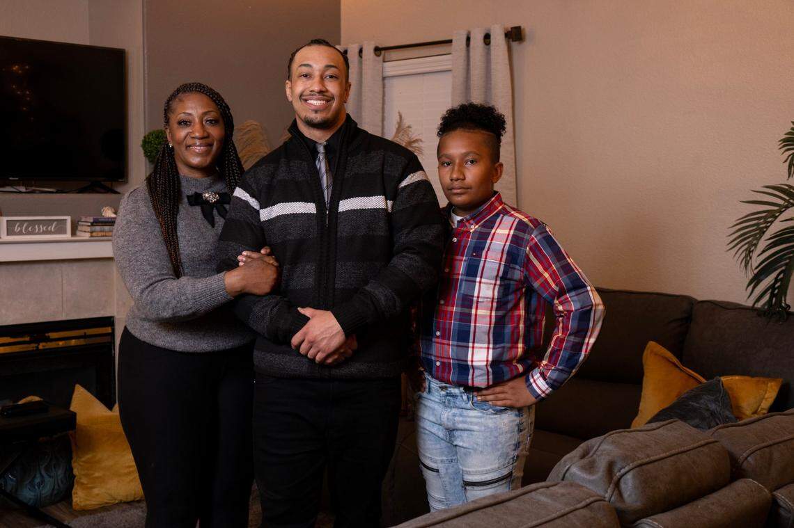 Harvest Davidson, 27, center, stands with his mom Cottina Perry and brother Caleb Falla, 13, in Sacramento on Dec. 20. Harvest Davidson spent seven years in an El Dorado County jail cell awaiting trial for a South Lake Tahoe homicide he was accused of.