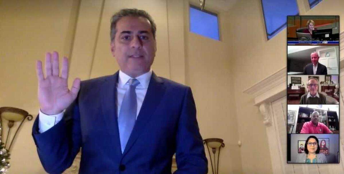 In image taken from a livestream of the Dec. 15, 2020, Sacramento City Council meeting, Sean Loloee is sworn in to represent Del Paso Heights from the interior of a home that matches the home owned by his wife, Maryam Seirafi.