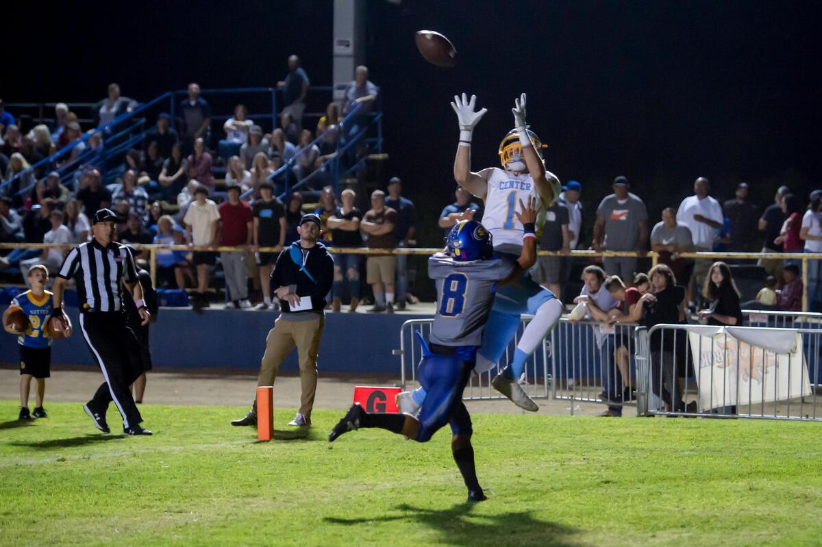 Center’s Elias Bonds (1) catches the ball in the end zone for a touchdown over Sutter’s Jeffrey Azevedo (8) tying the score 20-20 after the field goal during the fourth quarter in the game Friday at Sutter High Schoo. The Huskies won 23-20 in overtime.