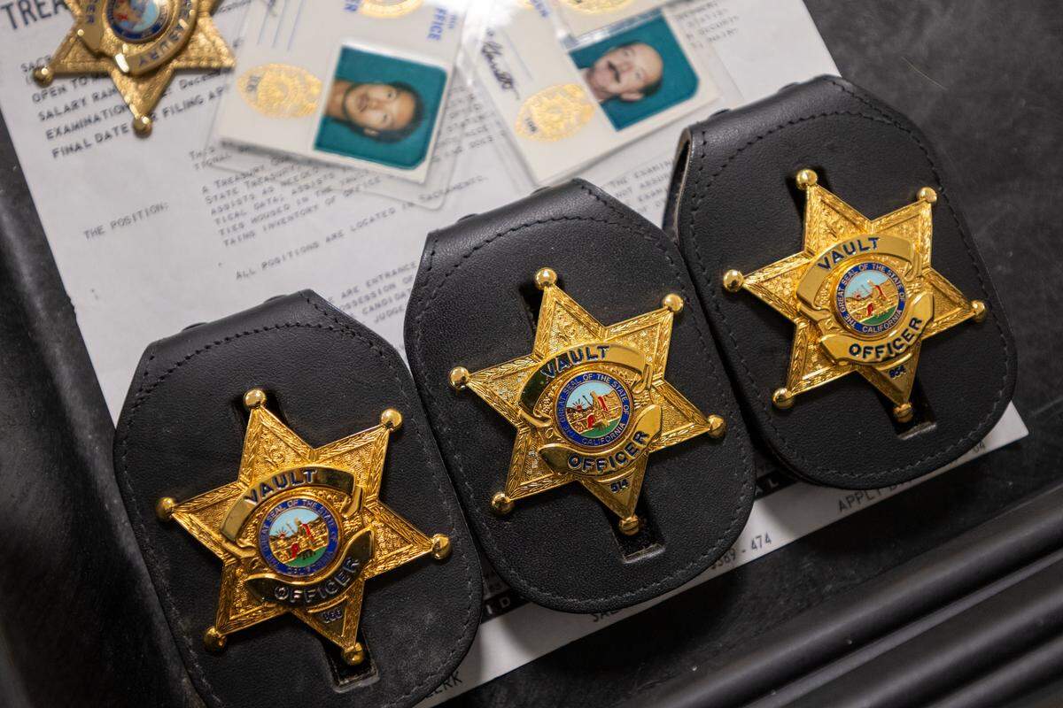 Historical vault officer badges are displayed at the Jesse M. Unruh Building in Sacramento on earlier this month. 