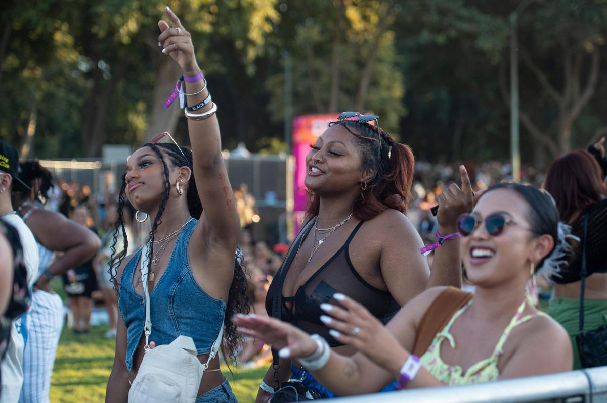 Jordyn Baylis, left, of Sacramento, Kylé-Ann Bobo, center, of Sacramento, and Lynn Ly, of Los Angeles, dance to music while they wait for rapper Joey Bada$ to perform on the first day of the Sol Blume R&B festival on Saturday, Aug. 19, 2023, at Discovery Park in Sacramento.