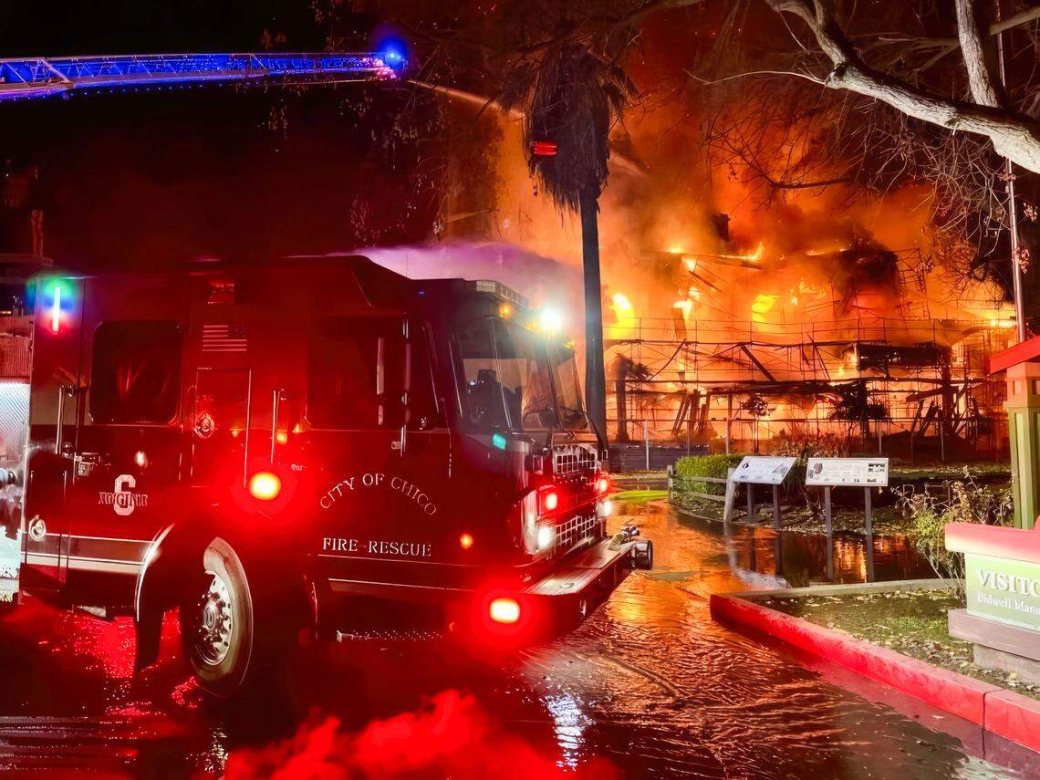 Firefighters attempt to extinguish a blaze at the Bidwell Mansion, a California State Historic Park building in Chico, before dawn on Wednesday, Dec. 11, 2024.