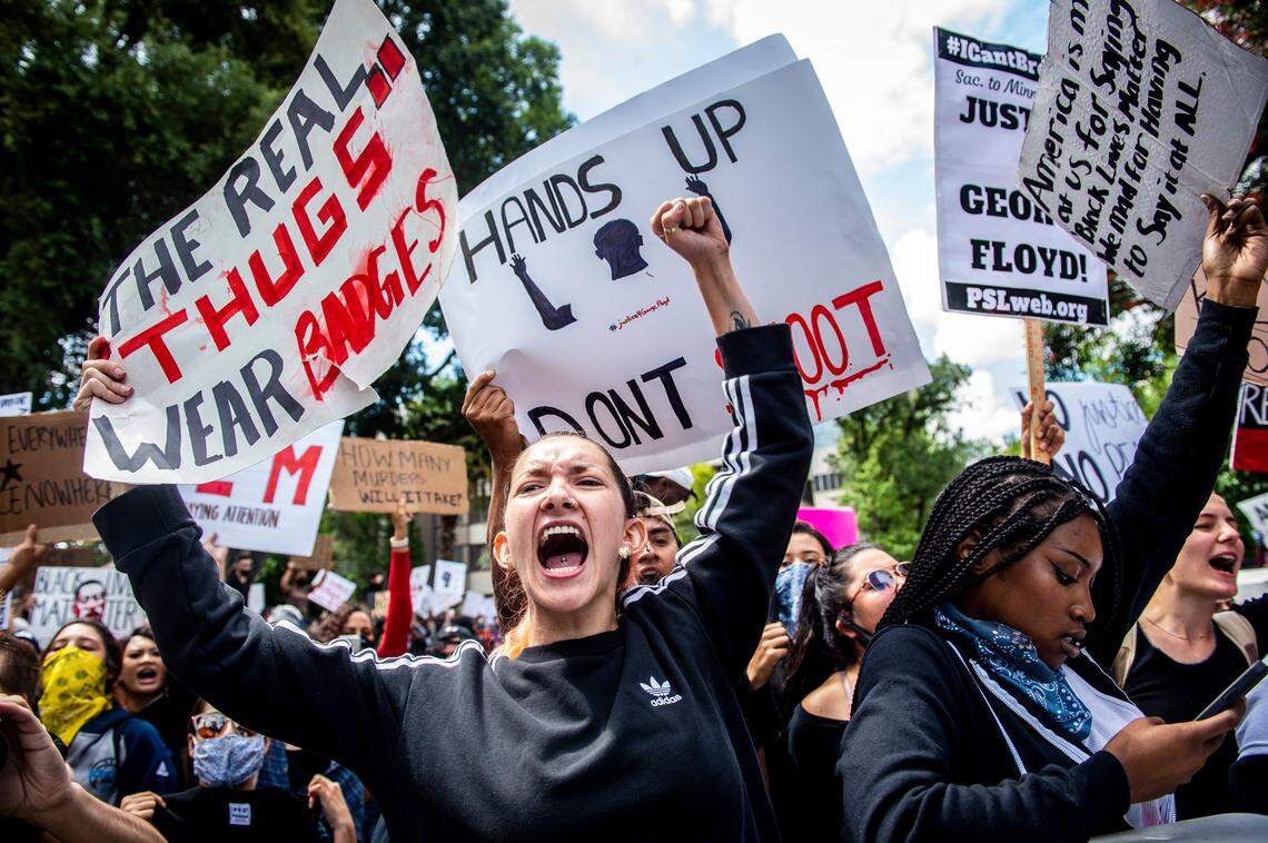 Protesters yell in unison in reaction to the death of Minneapolis man George Floyd on the south side of the Capitol in downtown Sacramento, Saturday, May 30, 2020.