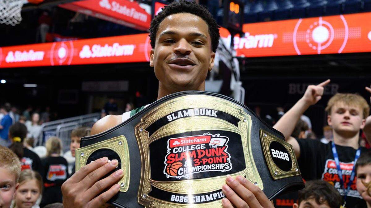Shaqir O’Neal, of the Sacramento State men’s basketball team in 2025-26, shows off his championship belt after winning the NCAA dunk contest Friday at the 37th State Farm College Slam Dunk & 3-point Championship in Indianapolis.