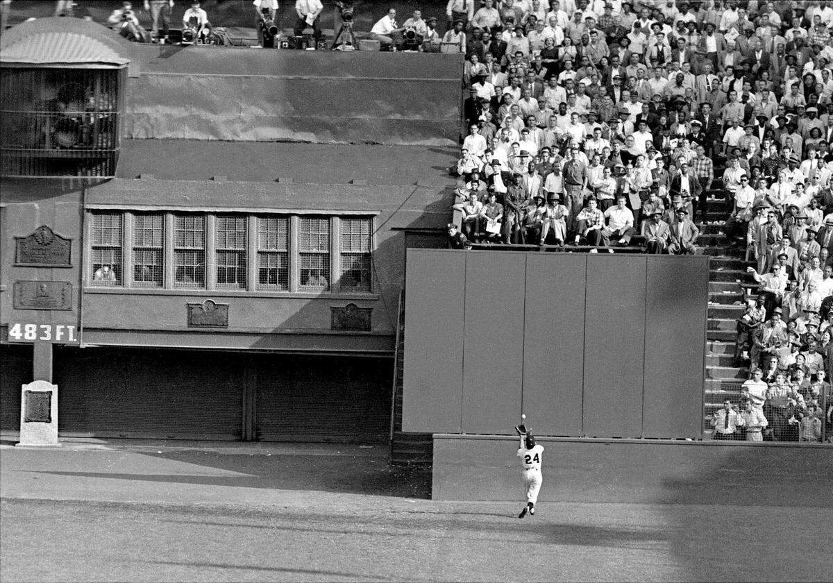 New York Giants outfielder Willie Mays runs to the end of the field at the Polo Grounds in New York to complete “The Catch,” an improbable over-the-shoulder catch of a deep-fly ball hit by Cleveland Indians batter Vic Werts to keep Game 1 of the 1954 World Series tied at 2-2. The Giants won the game 5-2 in 10 innings and swept the series.