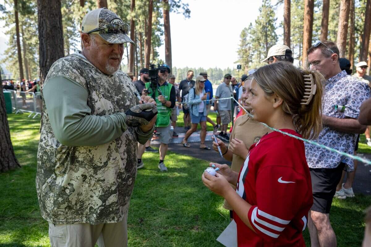Larry The Cable Guy signs autographs during the American Century Championship celebrity golf tournament at Edgewood Tahoe Resort in Stateline, Nev., on Friday, July 11, 2025.