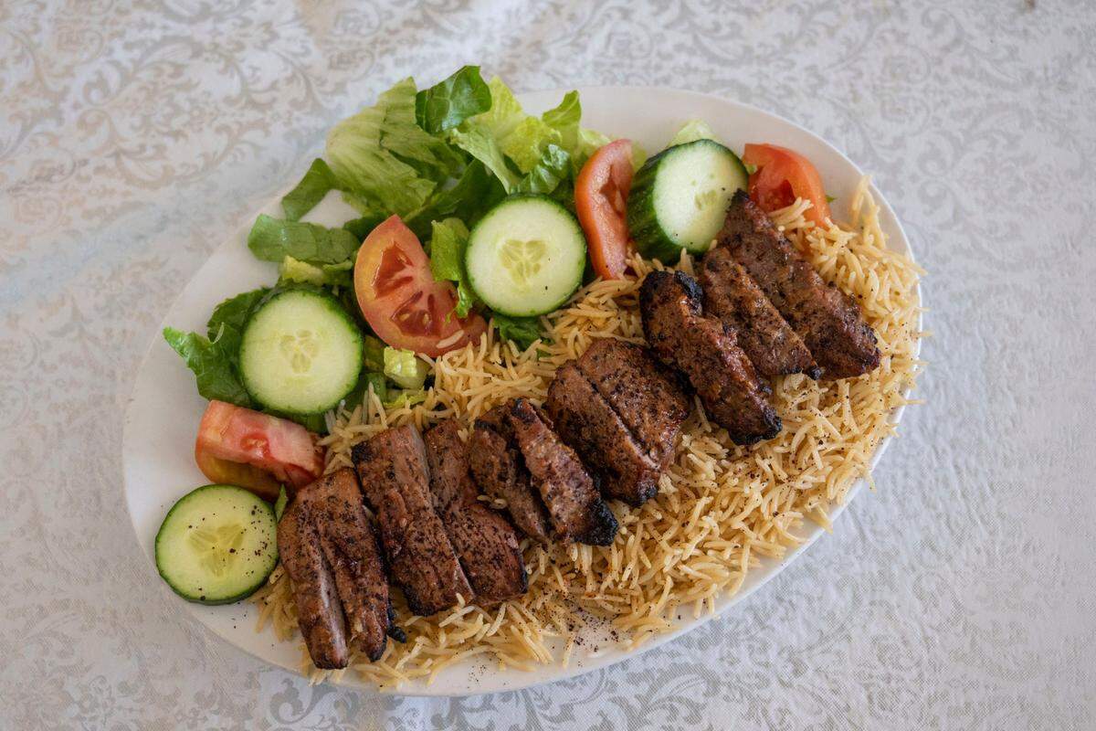 A beef kabob plate served on a bed of rice and a salad on Thursday, Nov. 17, 2022, at Chopan Kabob in Elk Grove.