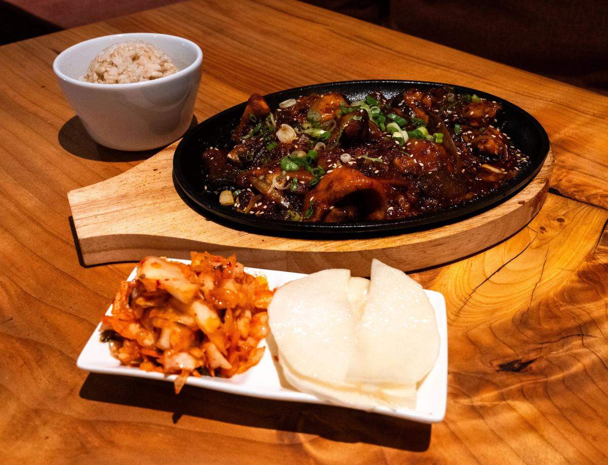 The plant-based Korean bulgogi, made with trumpet shiitake mushrooms, at Village of Om Plant Kitchen on July 1. The dish is served with a side of white or brown rice and paired with daikon and radish.