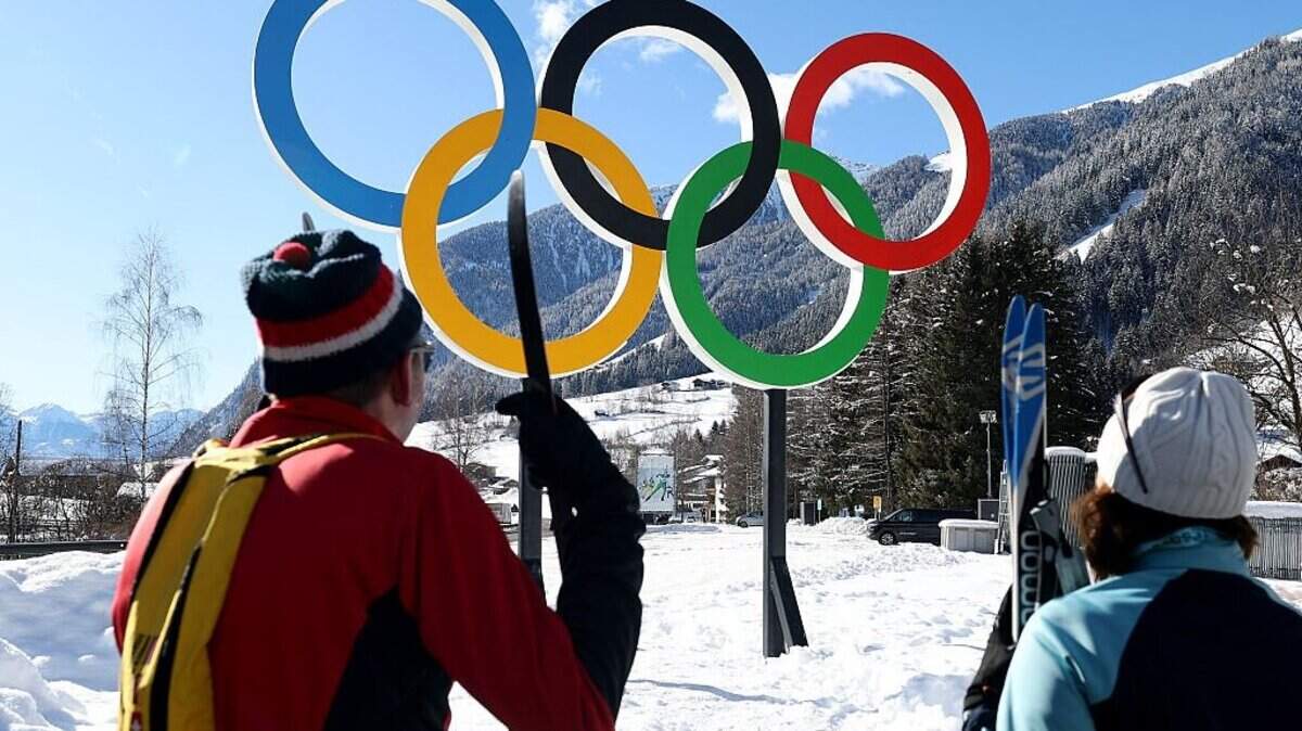 A general view of the Olympic Rings in Antholz Village ahead of the Milano Cortina 2026 Winter Olympics. The 2026 Olympic ice hockey in Milan will be a geopolitically charged tournament as U.S.-Canada tensions, ICE security and NHL players’ return heighten stakes.