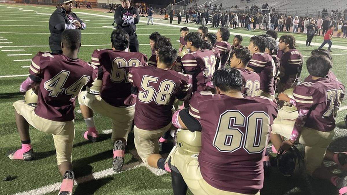 The Florin High School football team gathers at midfield for the final time following a season-ending loss to Valley on Friday, Oct. 27, 2023.