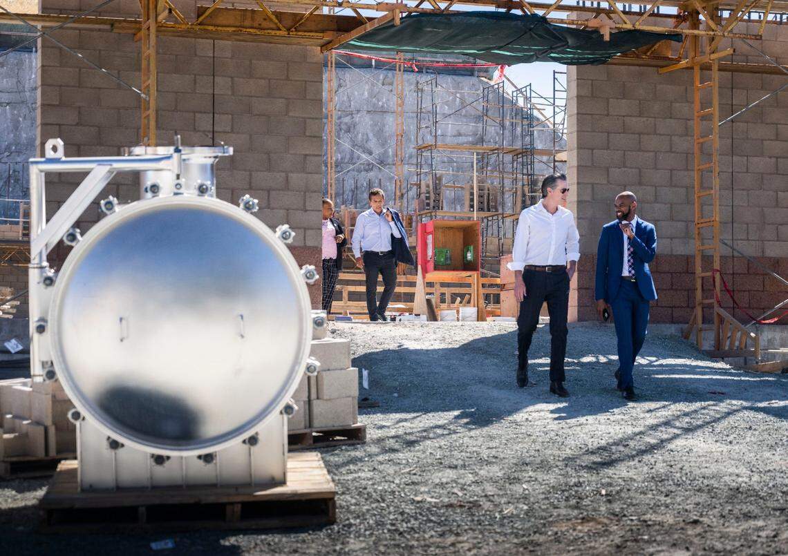 Gov. Gavin Newsom walks out of the Brackish Water Desalination Project construction site at the Antioch Water Treatment Plant with Antioch Mayor Lamar Thorpe on Thursday, during a press conference where he outlined a new plan for drought and water shortages.