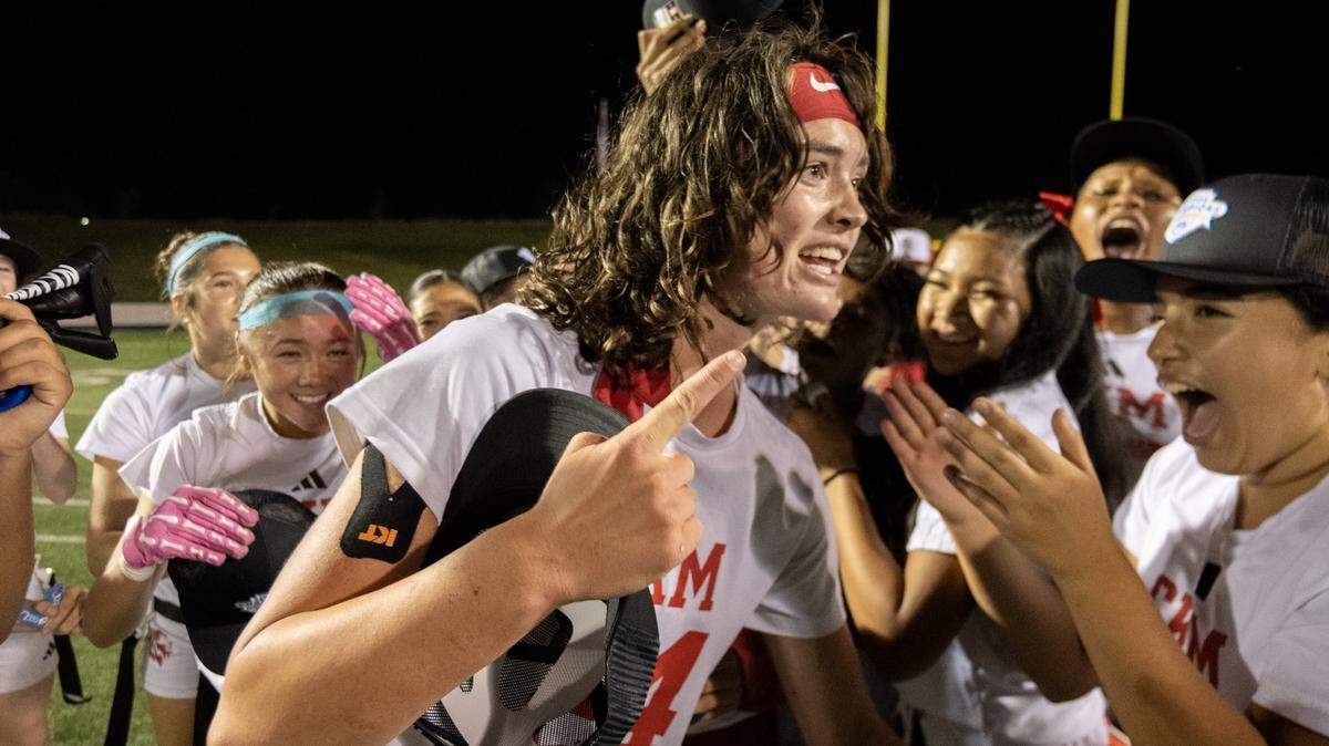 McClatchy Lions quarterback Daisy Throckmorton celebrates with her teammates following the CIF Sac-Joaquin Section Division I flag football championship game against the West Park Panthers on Saturday at Cosumnes River College in Sacramento.