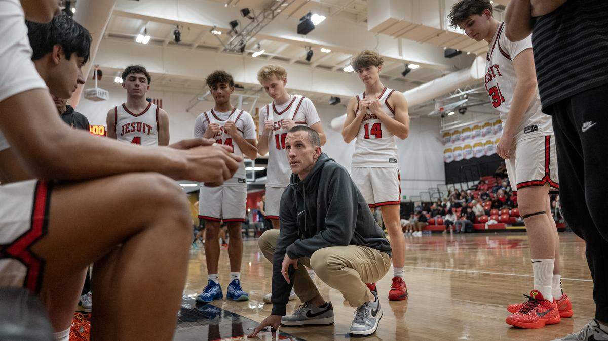 Jesuit Marauders boys basketball coach Tim Kelly talks with his team during a timeout in the first half in a game against the Granite Bay Grizzlies on Wednesday, Jan. 7 in Carmichael. Jesuit enters the CIF Sac-Joaquin Section playoffs as the top seed in Division II.