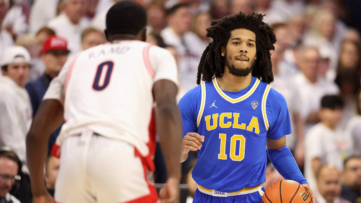 UCLA’s Tyger Campbell (10) handles the ball against Arizona’s Courtney Ramey (0) during the second half at McKale Center on Saturday, Jan. 21, 2023, in Tucson, Arizona. Ramey made the key three-pointer to lead the Wildcats over the Bruins to win the Pac-12 tournament on Saturday, March 11, 2023, in Las Vegas.
