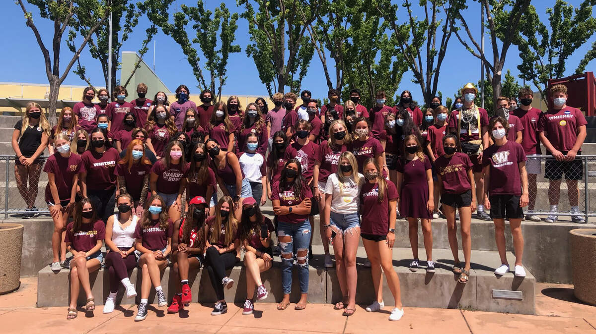In this unaltered handout photo, students leaders – some wearing small stickers and pins from the conservative club Turning Point USA – pose for a picture at a campus Inclusion Week event at Whitney High School on May 14, 2021. A digitally edited version removing the stickers and pins was distributed by the school. 

