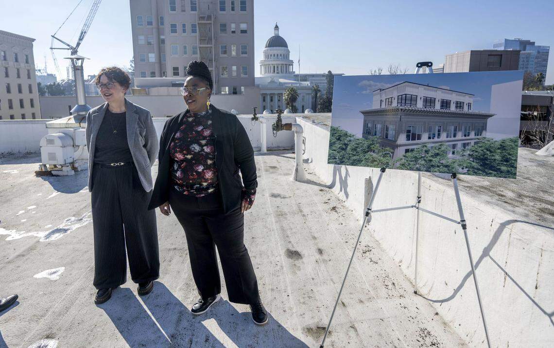 Architect Beth Young, with HGA, and Chastity Benson, the chief operating officer for the California State Association of Counties, stand on the roof of 1100 K Street in Sacramento on Thursday. A planned remodel of the historic building will add an atrium on the roof.